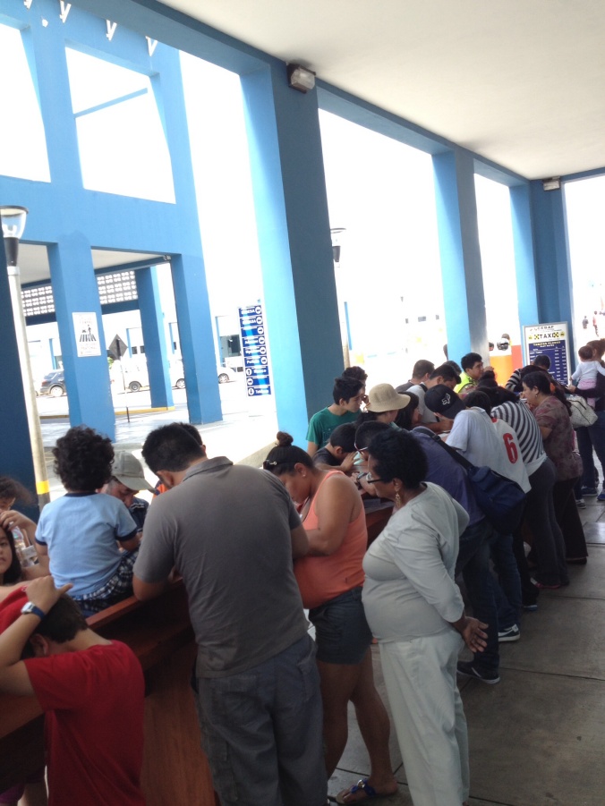 Filling out immigration cards at CEPNA Peru